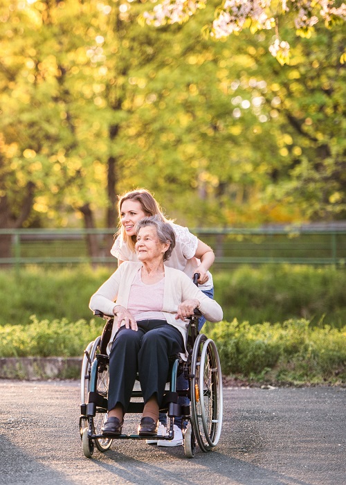 Elderly woman in wheelchair with daughter